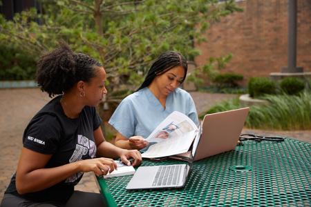 Medical students study in the courtyard of SIU School of Medicine