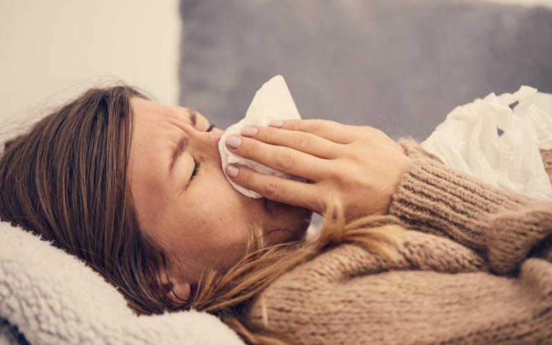 sniffle nose cold flu person