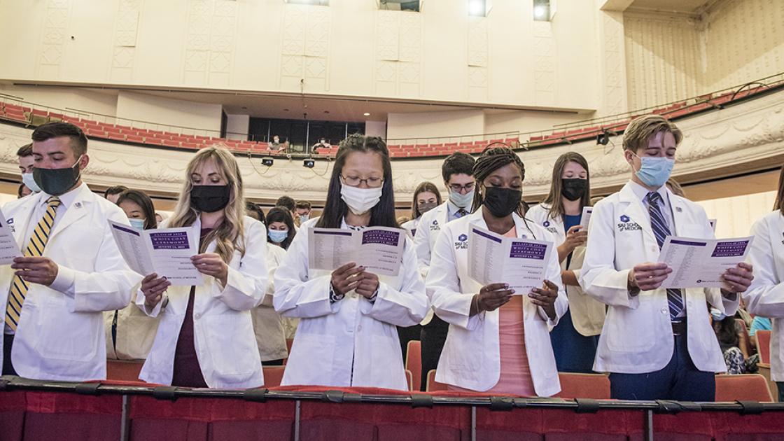 Students reciting the physician's pledge