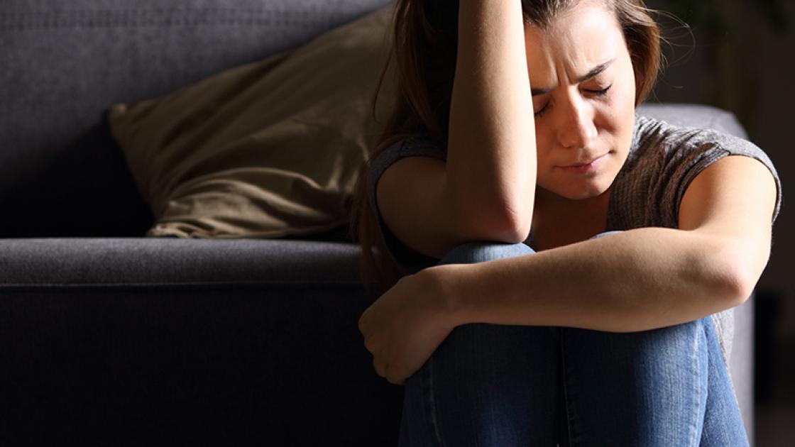 woman stressed gloomy room