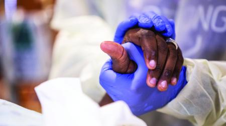 Holding patients hand