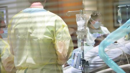 Doctors working with patient 