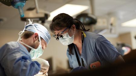 Dr. Zhang supervises residents in the Surgical Skills Lab