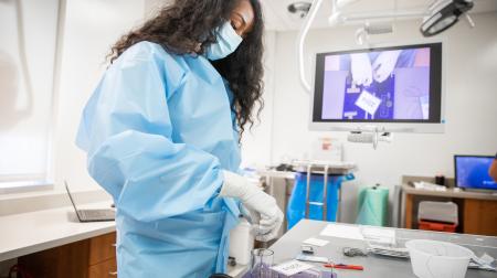 Dr. Catterall perfects her surgical skills in simulation lab