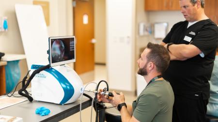 Urology faculty practicing with new equipment
