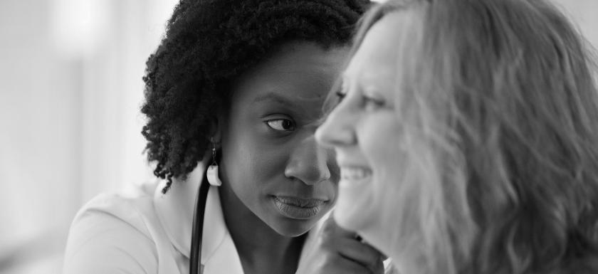 doctor examines patient's ear