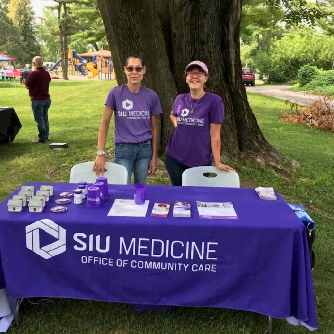 Nicol and Kay working with the community