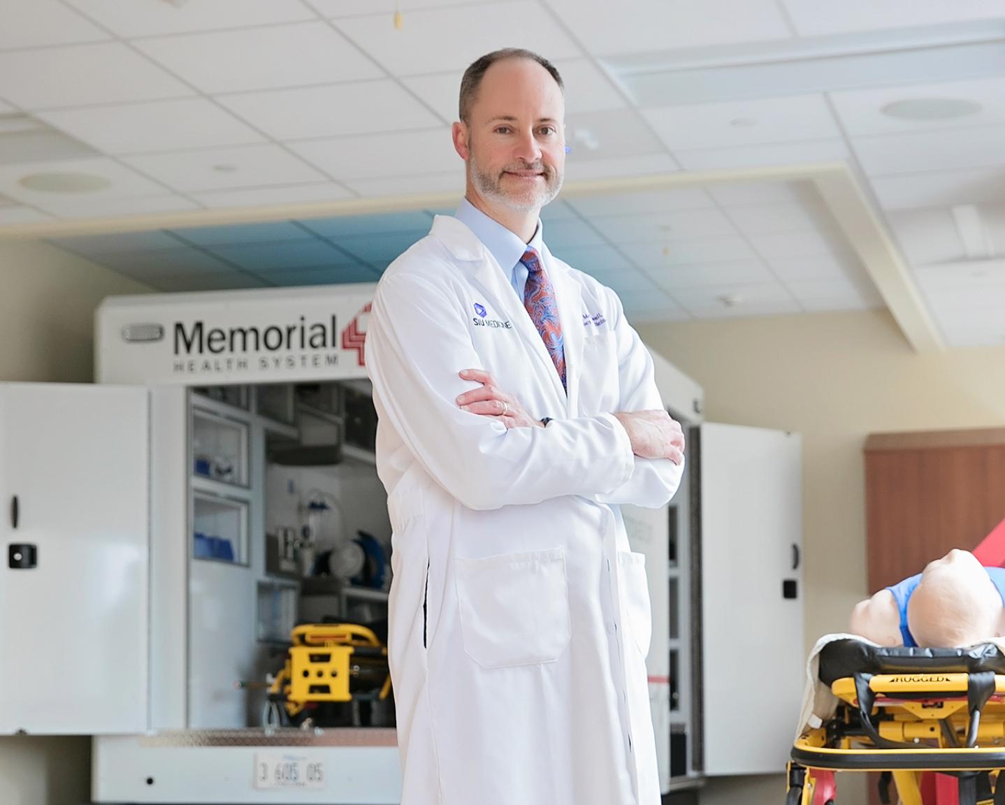 Dr. Christopher McDowell in front of ambulance bay