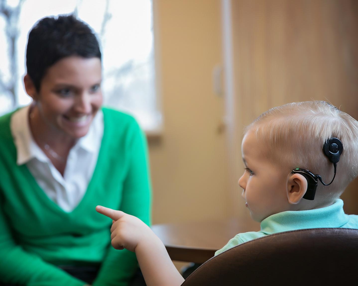 Boy with cochlear implant