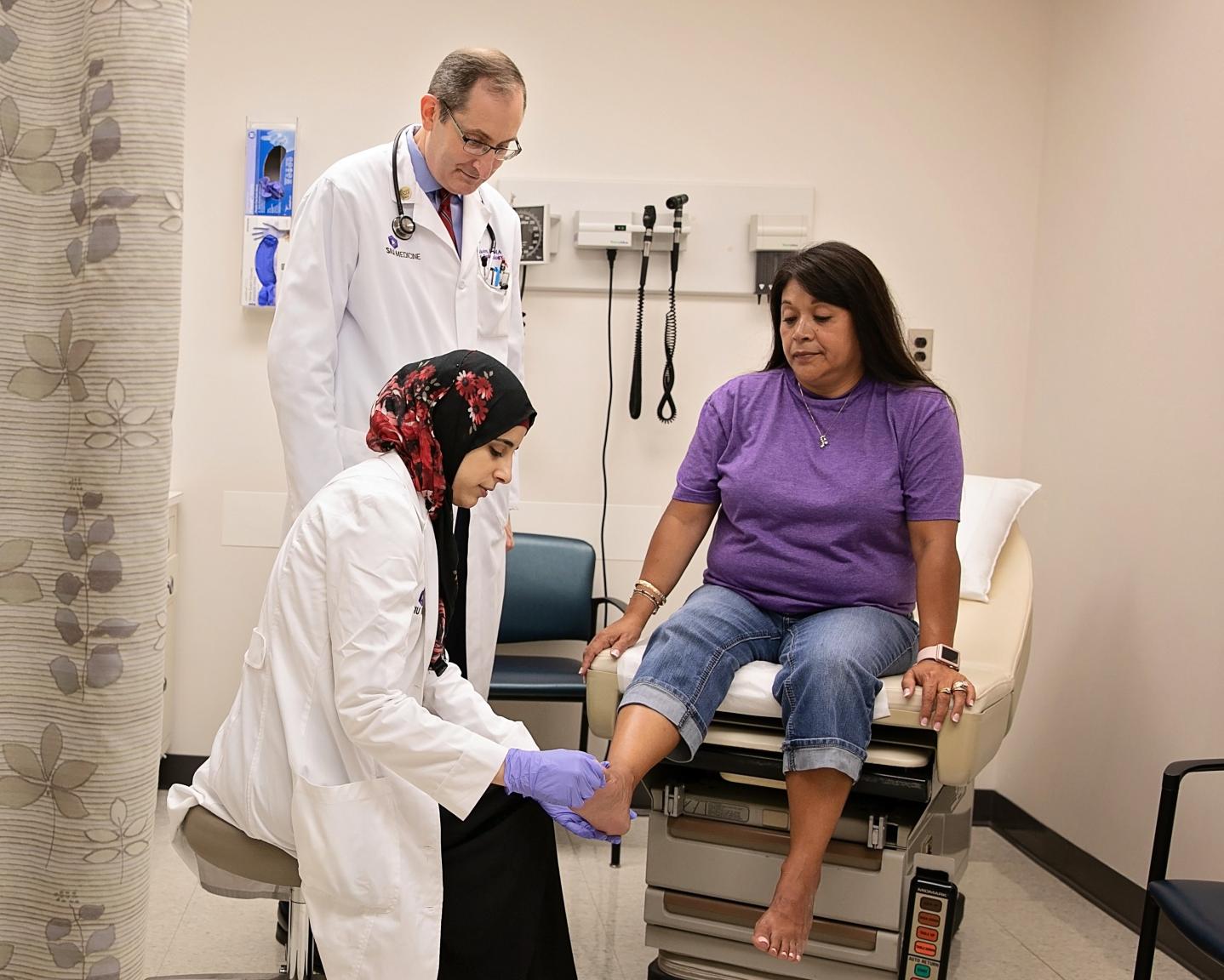 Endocrinology physicians with patient