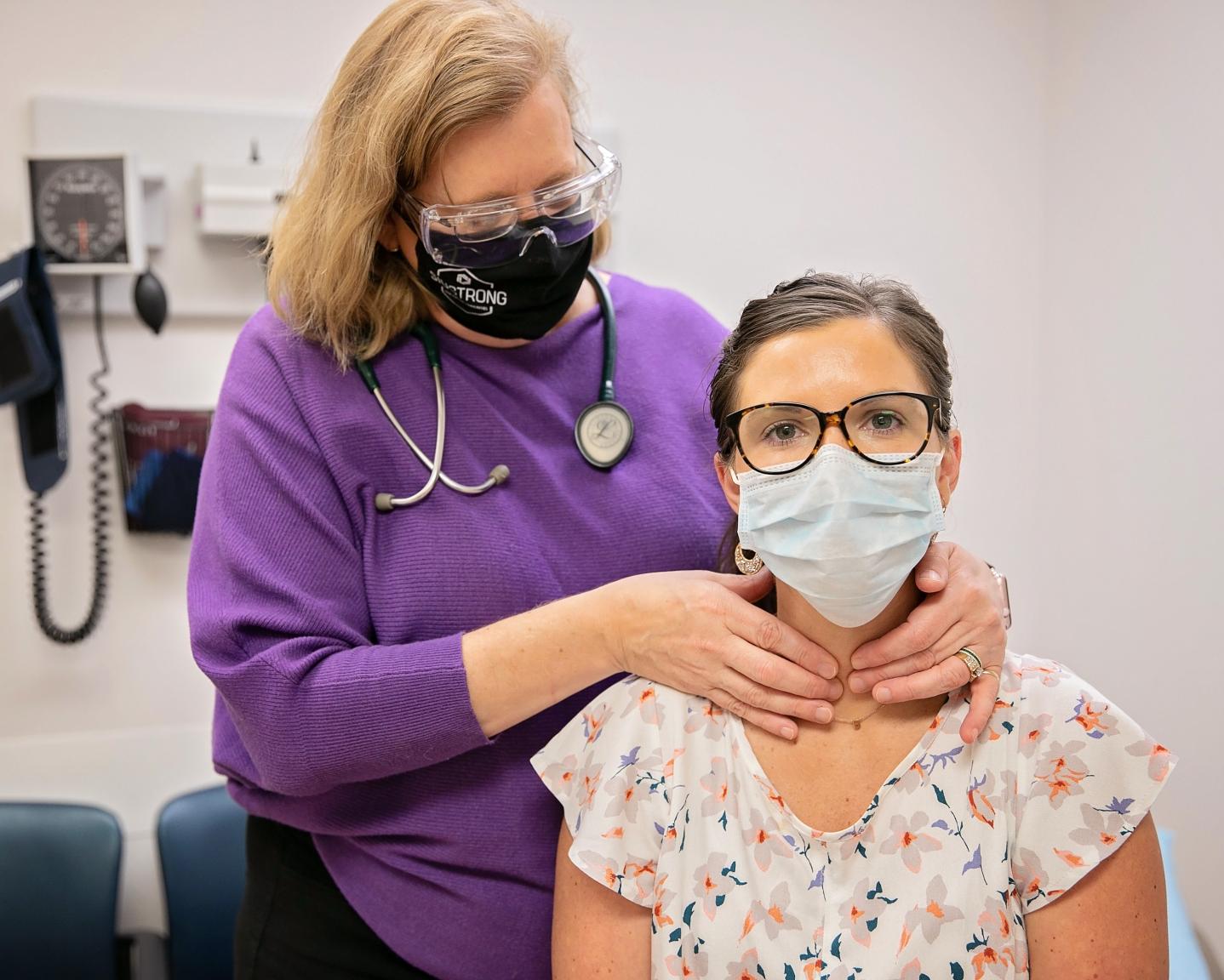 Woman receiving an exam from a doctor