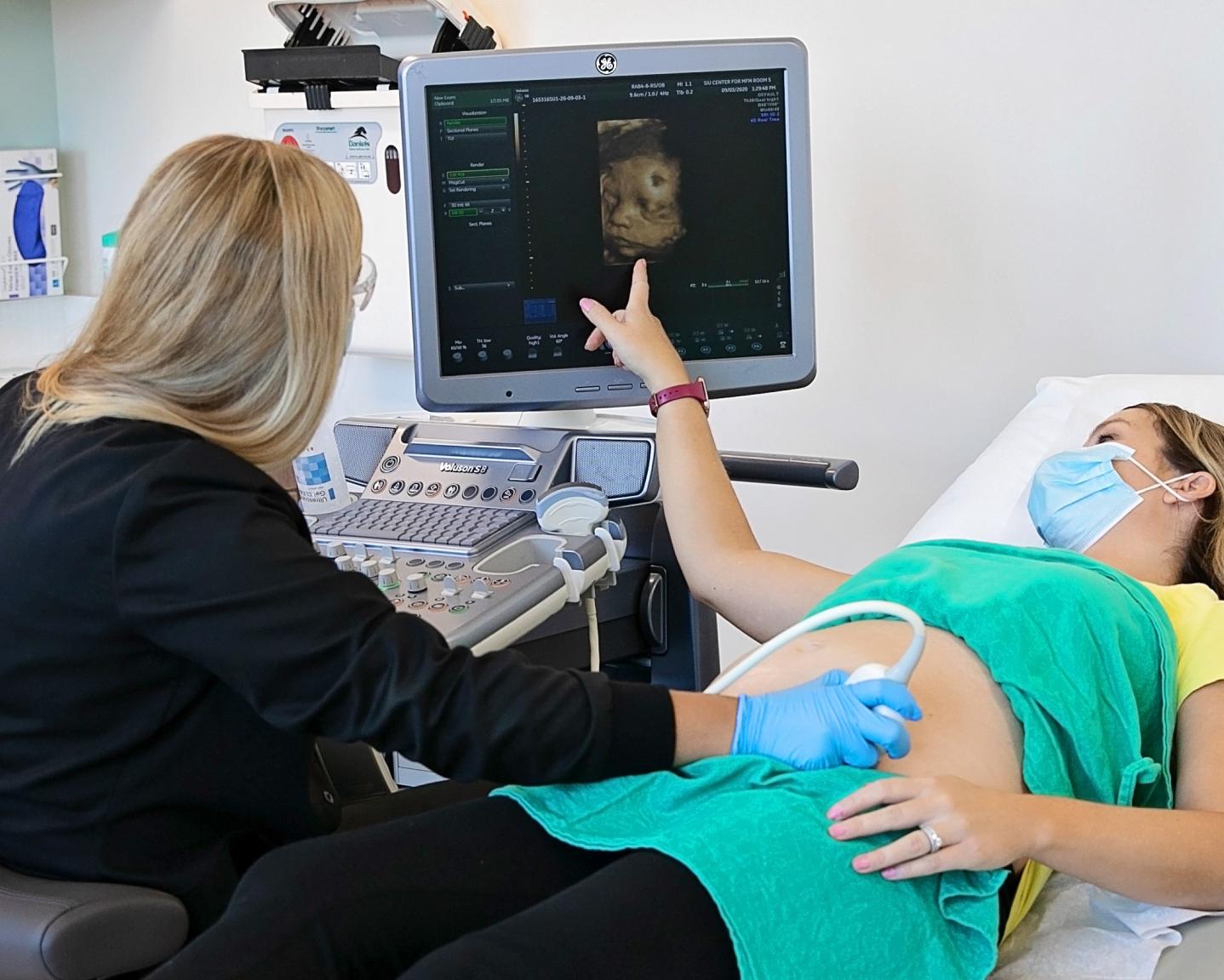 Sonographer With Pregnant Patient