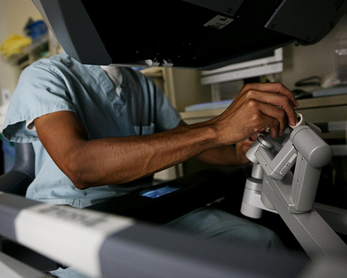 Doctor using medical equipment