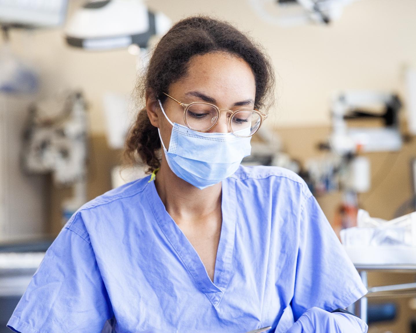 Nurse holding surgical tools