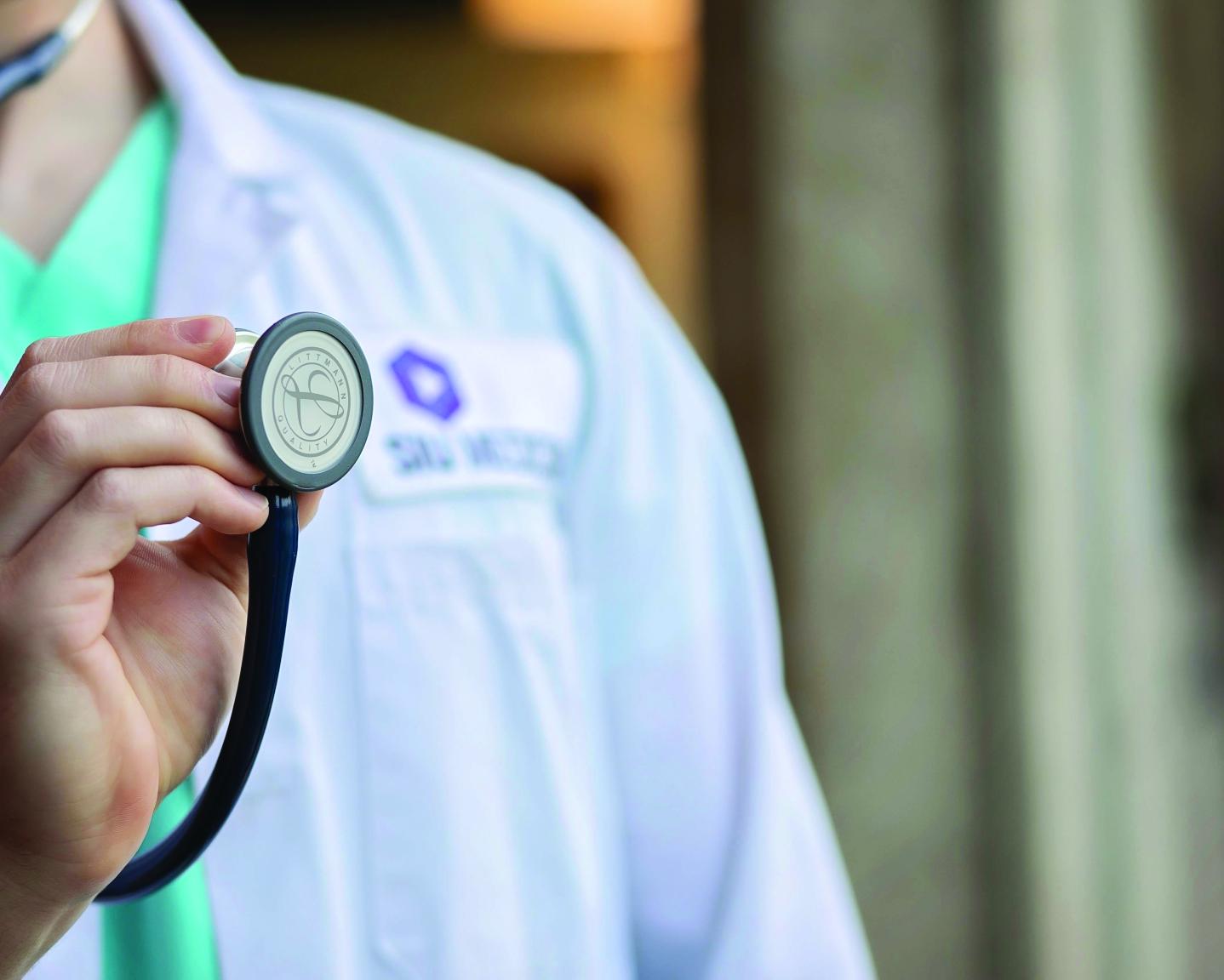 Med student holding stethoscope 