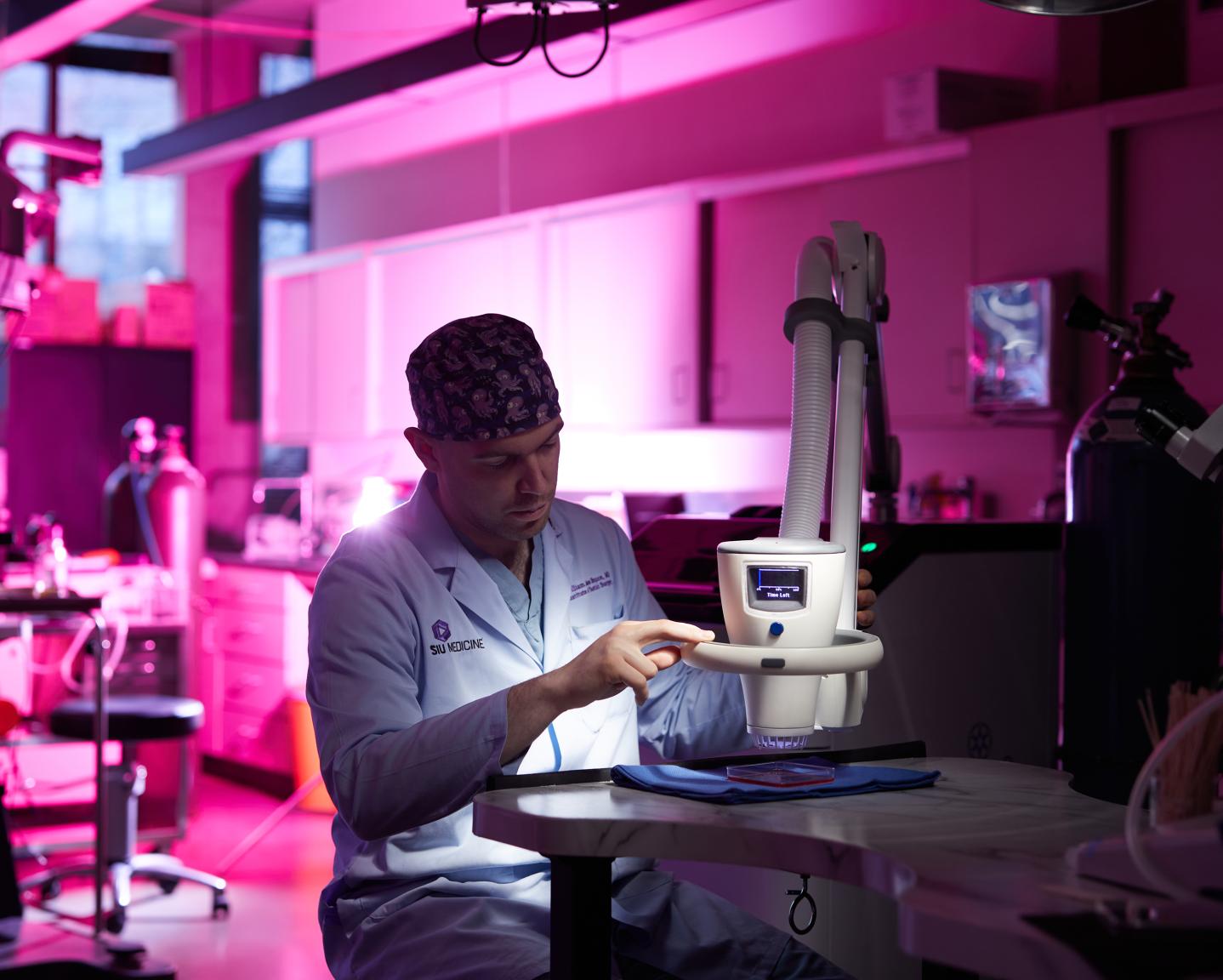 Researcher using a plasma machine in the laboratory