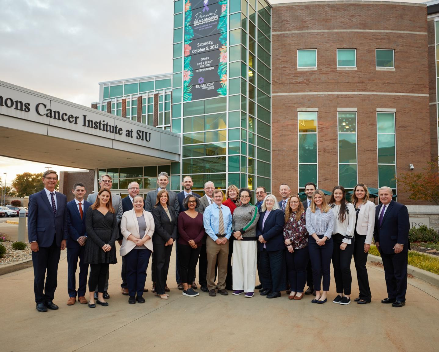 Photo of the 2023 Alumni Board of Governors outside Simmons Cancer Institute