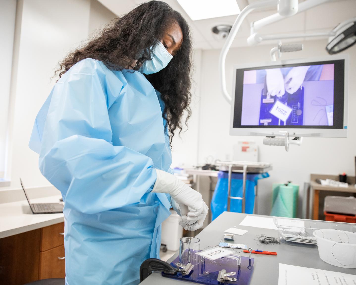 Dr. Catterall perfects her surgical skills in simulation lab