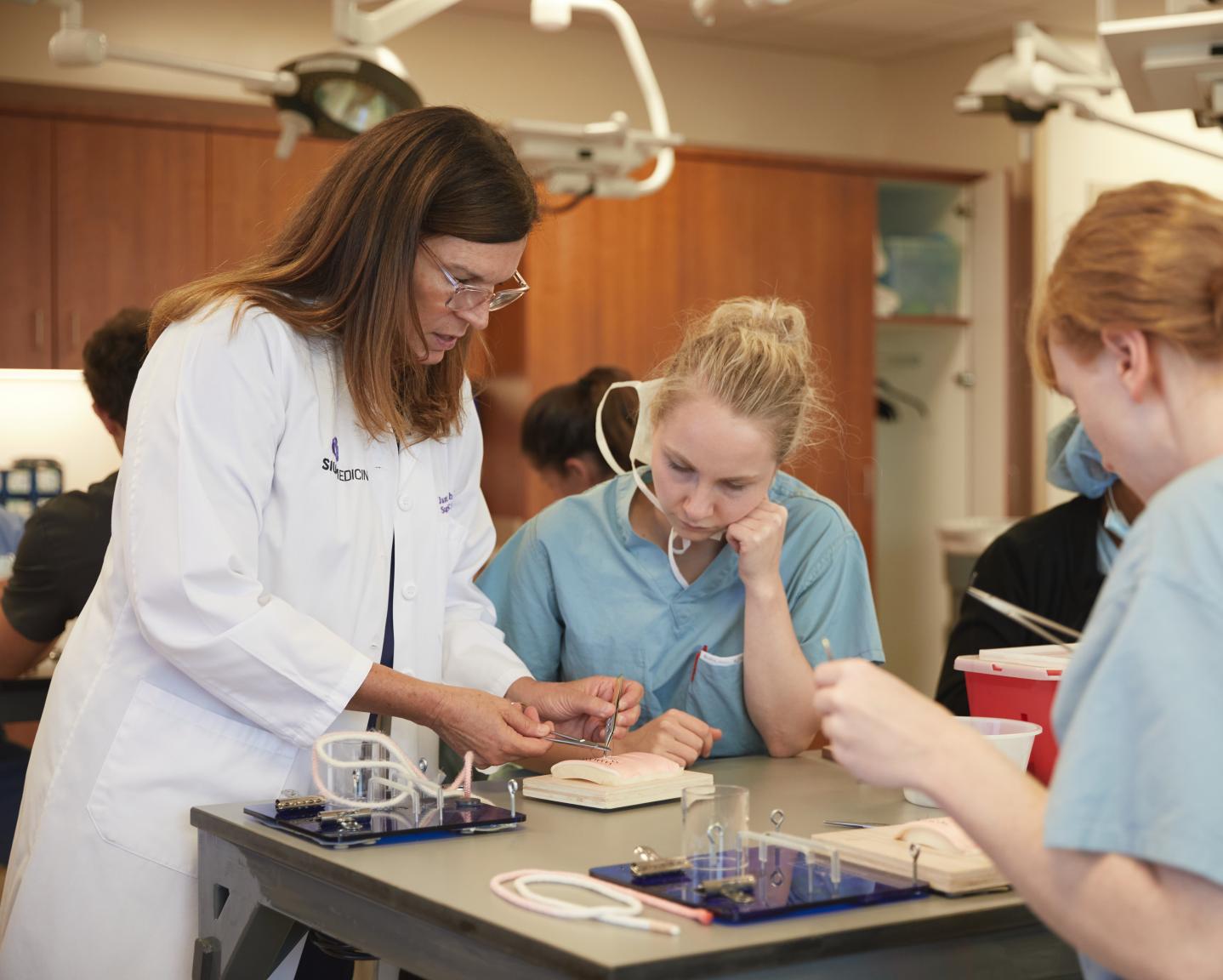 Surgical knot tying demonstrated by Skills Lab Director