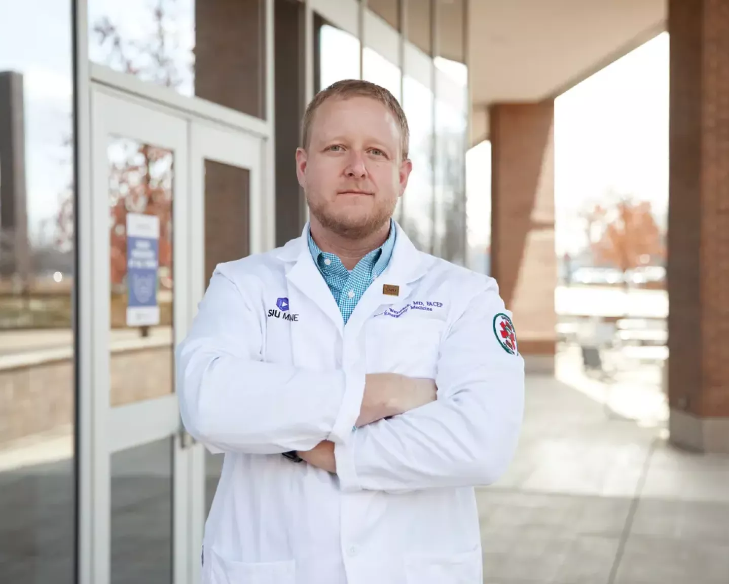 Dr. Waymack in front of SIU clinic building