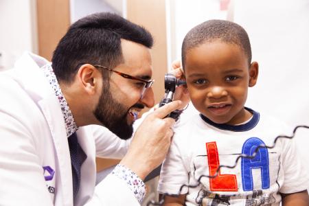 Dr. Nav Badesha with pediatric patient