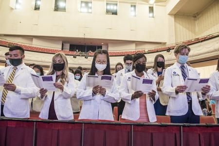 Students reciting the physician's pledge