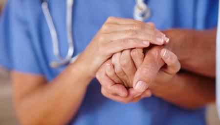 doctor holding patient hands