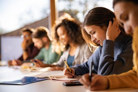 Highschool students working in classroom together