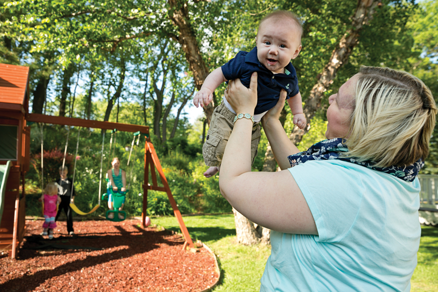 McKenzie Sargent and her fourth child, Bryar, 5 months, who had the same life-threatening complications at birth as his older sister. Braylee, 3, Carter, 8, and Shaylon, 11, play in the background.