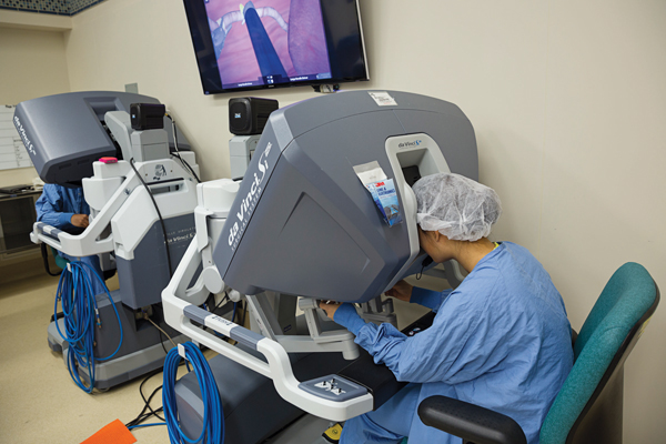 The dual console, above, allows the attending physician and resident to work seamlessly through a surgery.