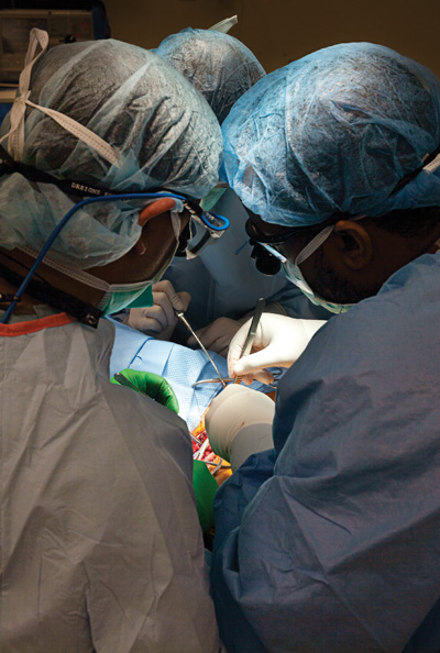 Dr. Desai and Dr. Jason Andre, PGY4, perform TOS surgery on Tristen Karrick.